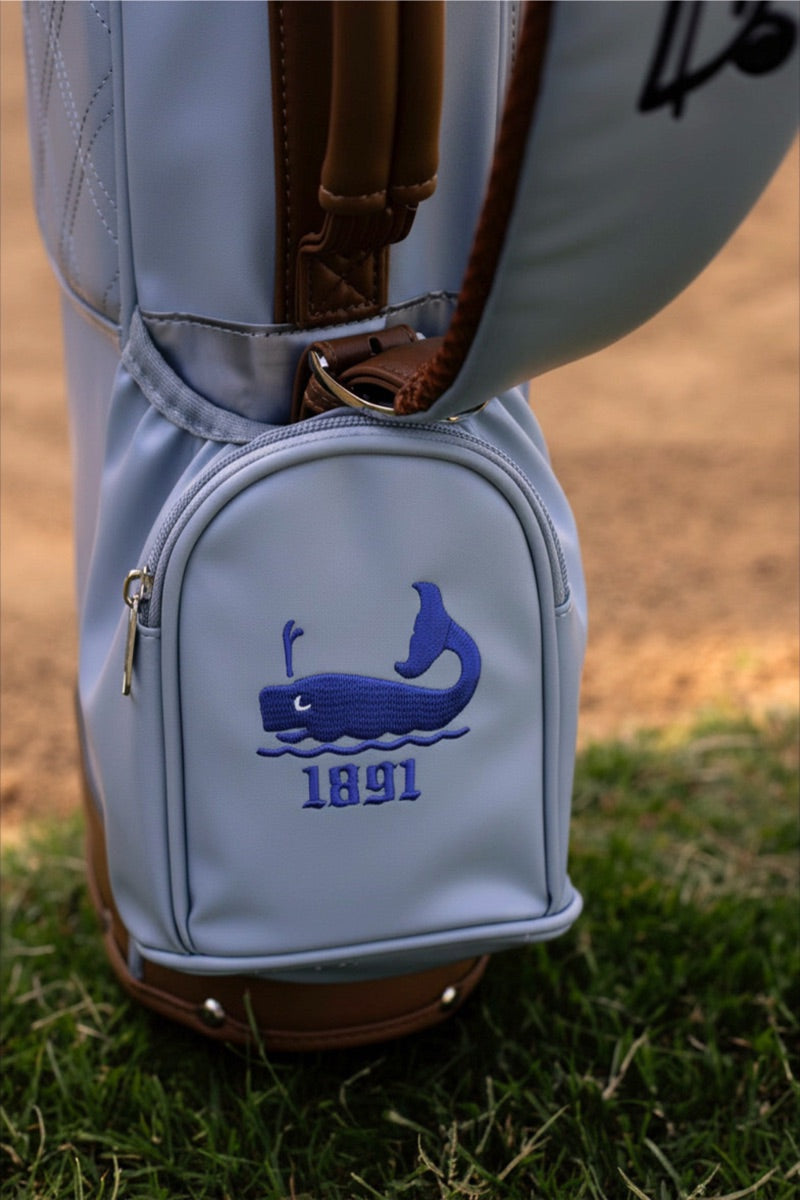Custom whale logo embroidered on a bag's ball pocket