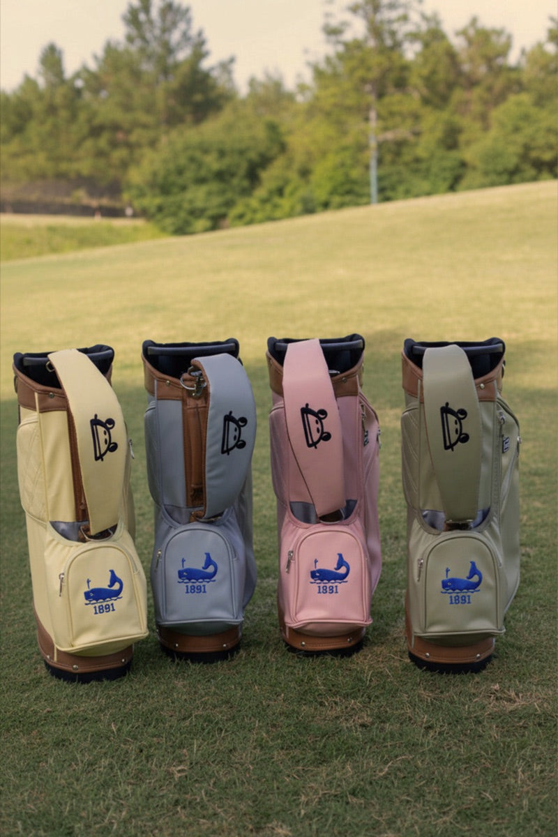 Custom Rana Golf bags in four colorways, lined up on the course